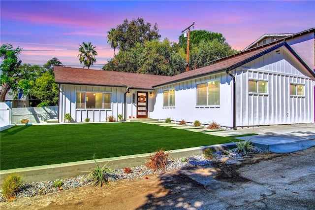 view of front of home with a yard