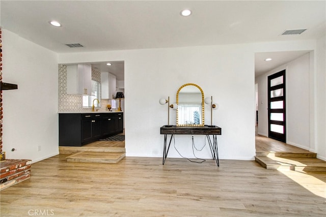 interior space featuring light hardwood / wood-style floors and sink