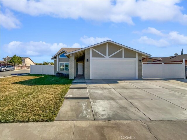 single story home featuring a front yard and a garage