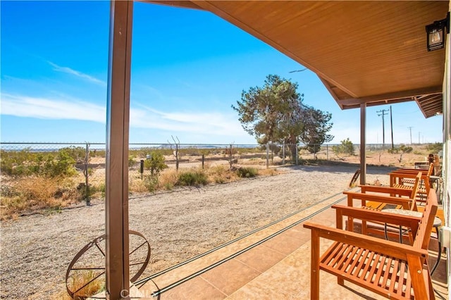 view of patio / terrace with a rural view