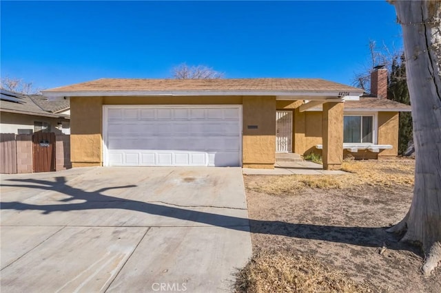 ranch-style home featuring a garage