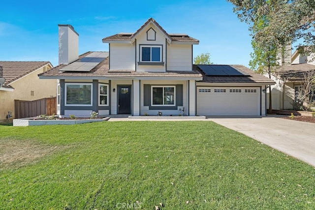 view of front of property featuring solar panels, a porch, a garage, and a front yard