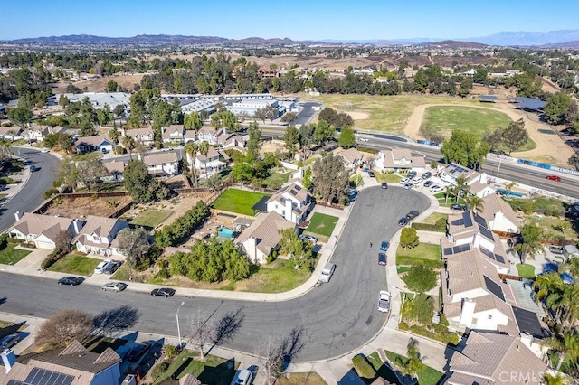 drone / aerial view featuring a mountain view