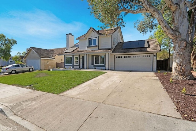 view of front of property with a front lawn, a garage, a porch, and solar panels