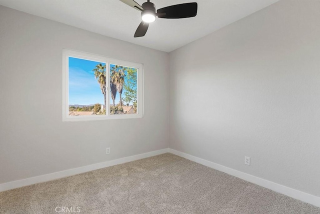 empty room featuring carpet flooring and ceiling fan