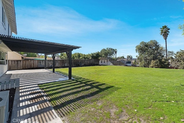 view of yard with a pergola and a patio