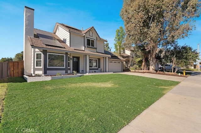 view of front of home featuring a front lawn, a porch, and solar panels