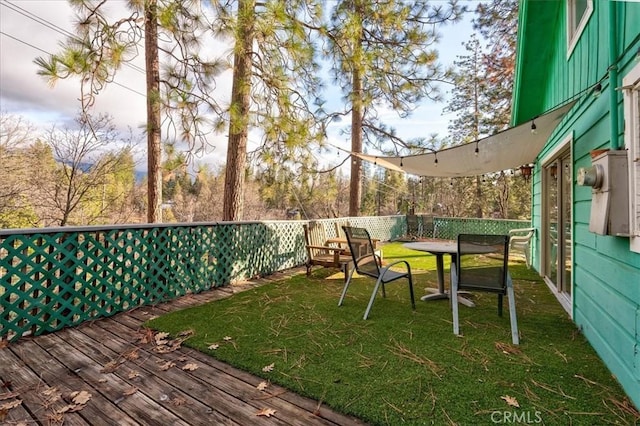 view of yard with a wooden deck