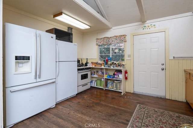 kitchen featuring beamed ceiling, white appliances, dark hardwood / wood-style floors, and wood walls