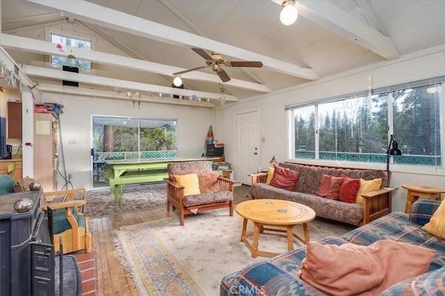 sunroom with vaulted ceiling with beams and ceiling fan