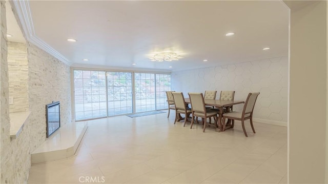 dining space with ornamental molding