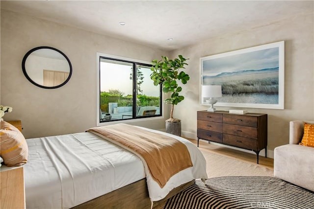 bedroom with light wood-type flooring