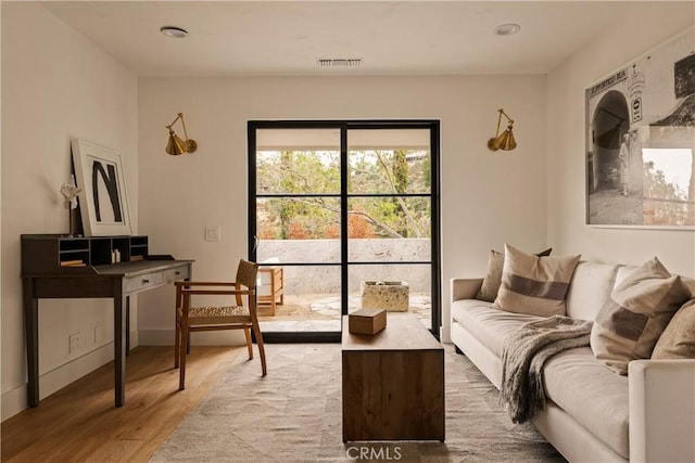 living area with wood-type flooring