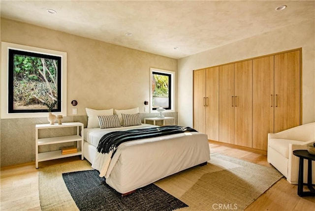 bedroom with light hardwood / wood-style floors