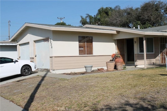 view of home's exterior with a yard and stucco siding