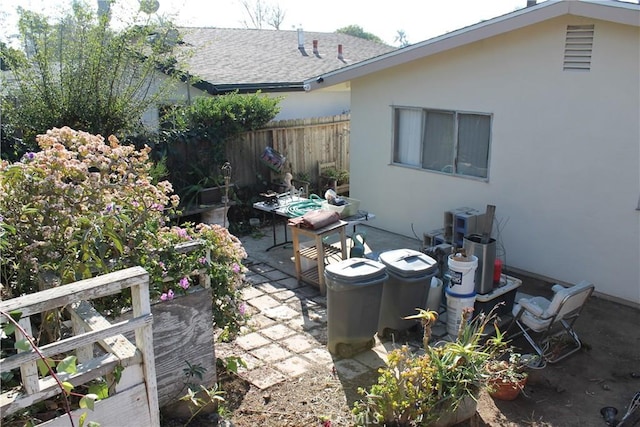 view of patio featuring fence