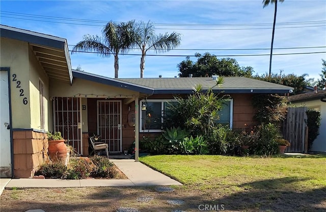 view of front of property with a front lawn