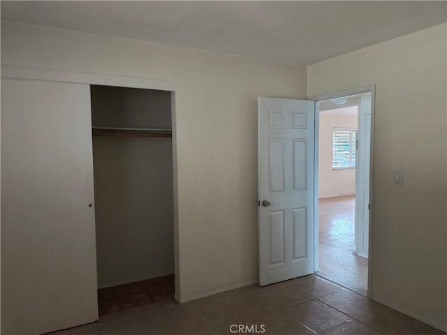 unfurnished bedroom with a closet