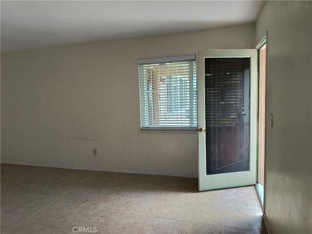 spare room with light tile patterned floors