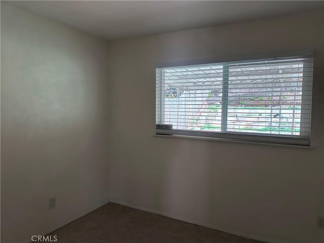 spare room featuring a wealth of natural light