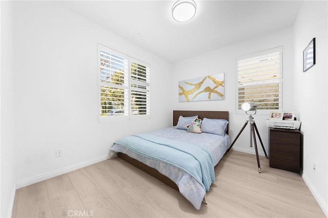 bedroom with light wood-type flooring