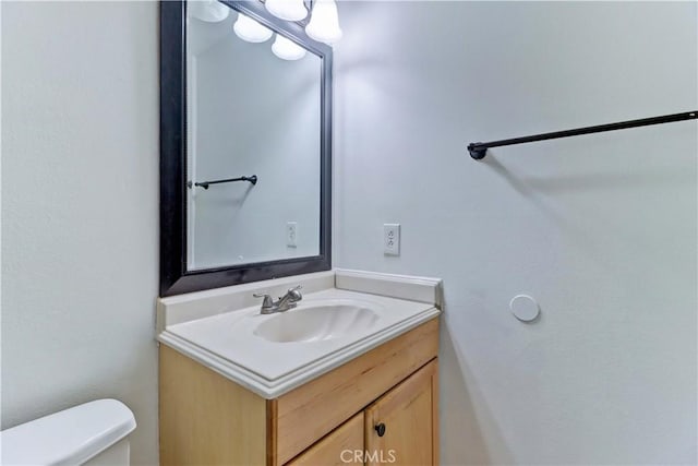 bathroom with vanity and toilet