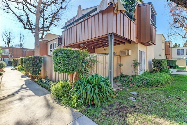 view of side of home with a balcony