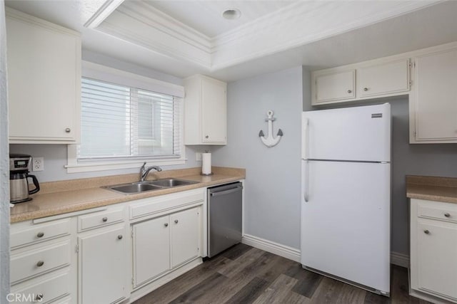 kitchen featuring a tray ceiling, sink, white refrigerator, dishwasher, and white cabinetry