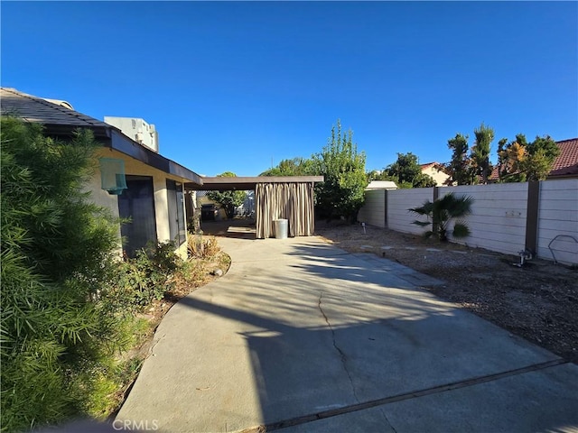 exterior space with a carport