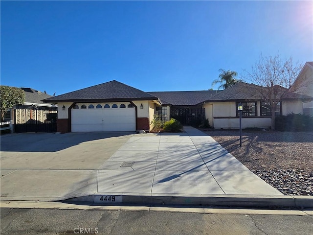 ranch-style house featuring a garage