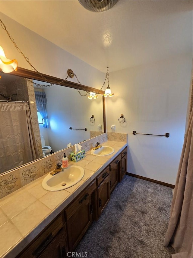 bathroom featuring vanity and toilet