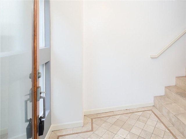 stairs with tile patterned flooring