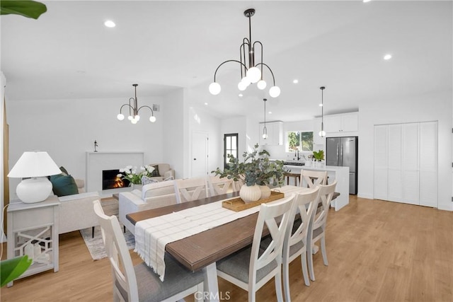 dining room featuring light hardwood / wood-style floors and a notable chandelier