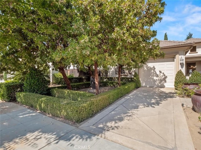 obstructed view of property featuring a garage