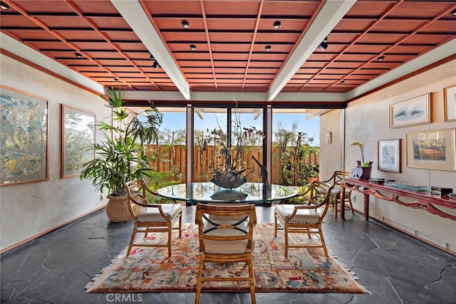 sunroom with beam ceiling and wood ceiling