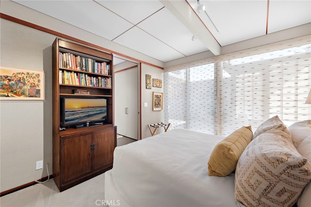 bedroom with beamed ceiling