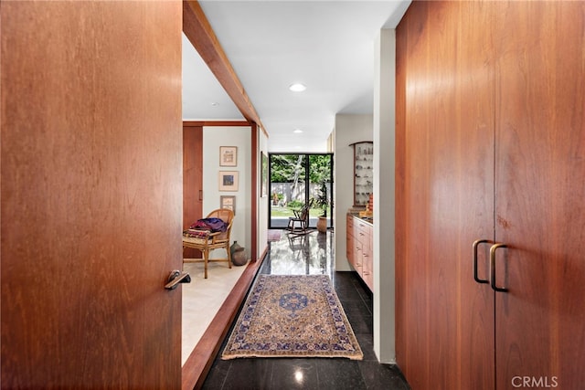 hallway featuring a wall of windows