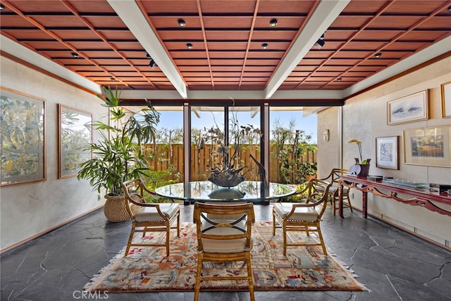 sunroom with beam ceiling and wood ceiling