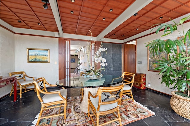 dining room featuring beamed ceiling, french doors, and wood ceiling