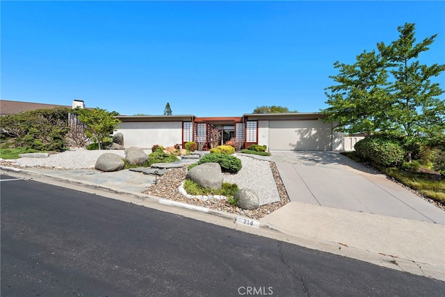 single story home featuring a garage