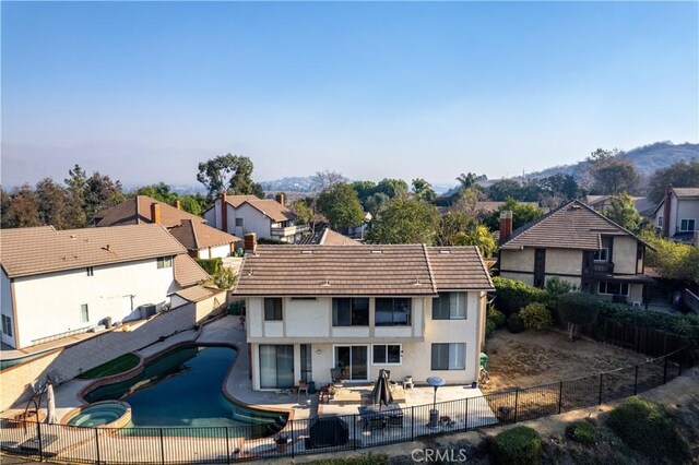 back of property featuring a patio