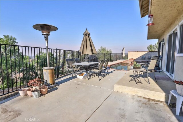 view of patio / terrace featuring a fenced in pool