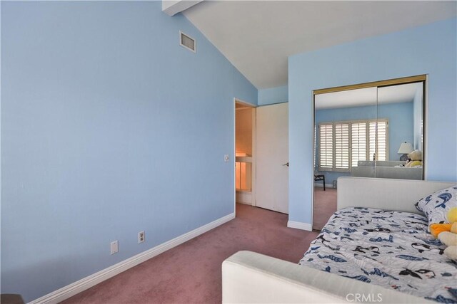 carpeted bedroom with a closet and lofted ceiling with beams