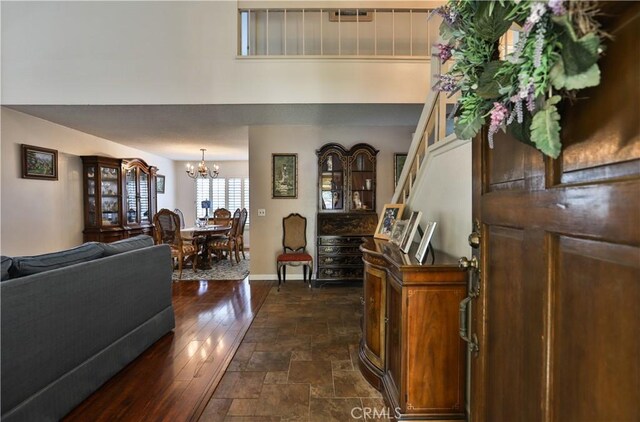 foyer with an inviting chandelier