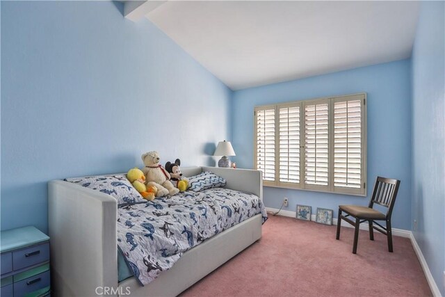 carpeted bedroom featuring vaulted ceiling with beams