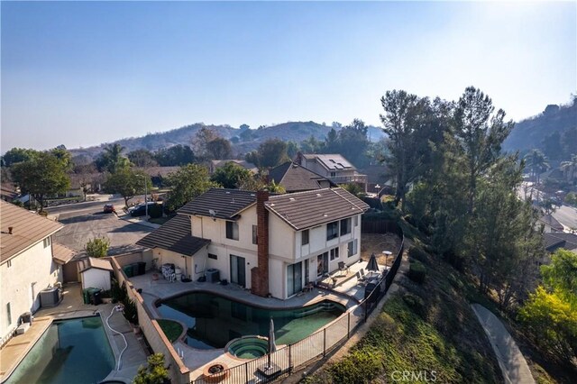 birds eye view of property with a mountain view