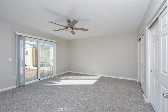 unfurnished bedroom featuring carpet, access to outside, and ceiling fan