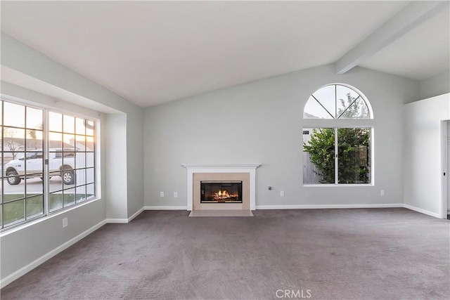 unfurnished living room with carpet and lofted ceiling with beams