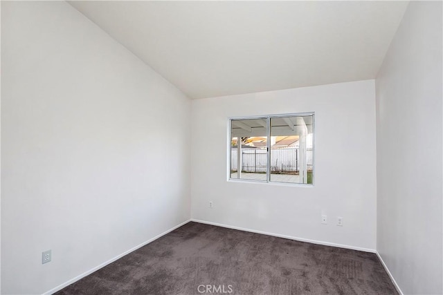 empty room with dark carpet