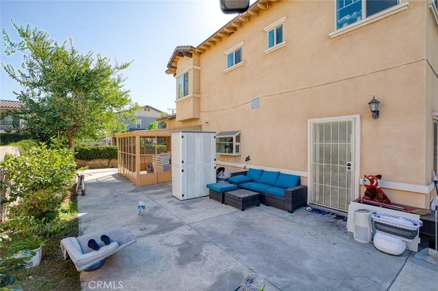 view of patio with a sunroom and an outdoor living space